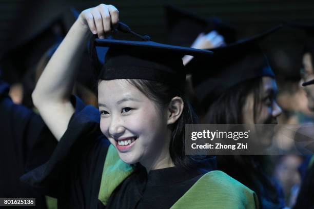 Students react during the graduation ceremony of Shantou University on June 27, 2017 in Shantou, China.