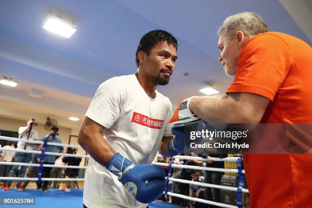 Manny Pacquiao and trainer Freddie Roach during a training session at Lang Park PCYC on June 27, 2017 in Brisbane, Australia.