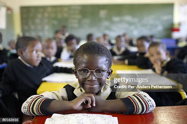 Student attends class in a Primary school on May 10, 2007 in Orlando West section of Soweto, South Africa. Many of the children are poor and live...