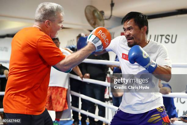 Manny Pacquiao and trainer Freddie Roach during a training session at Lang Park PCYC on June 27, 2017 in Brisbane, Australia.
