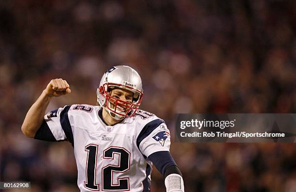 Tom Brady of the New England Patriots reacts after a touchdown against the New York Giants during their game on December 29, 2007 at Giants Stadium...