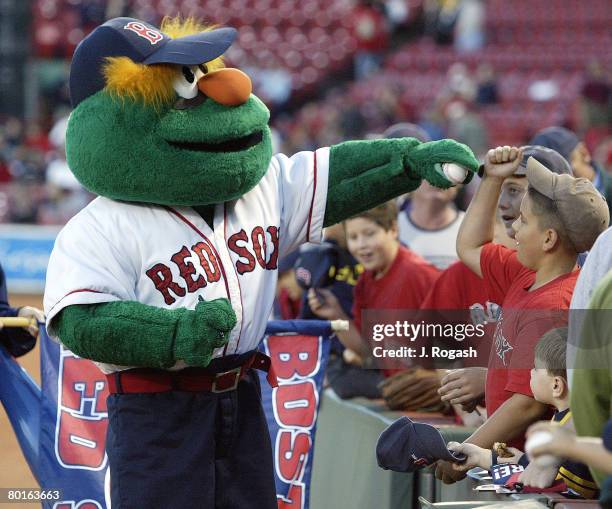 Boston Red Sox mascot Wally the Green Monster signs autographs for fans prior to the start opf a game against the Tampa Bay Devil Rays at Fenway Park...