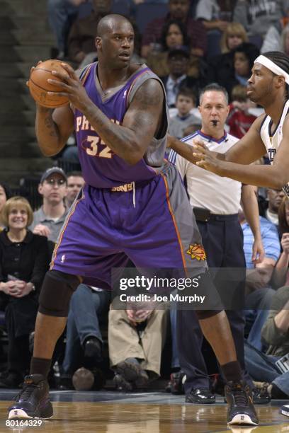 Shaquille O'Neal of the Phoenix Suns moves the ball during the NBA game against the Memphis Grizzlies on February 26, 2008 at FedExForum in Memphis,...