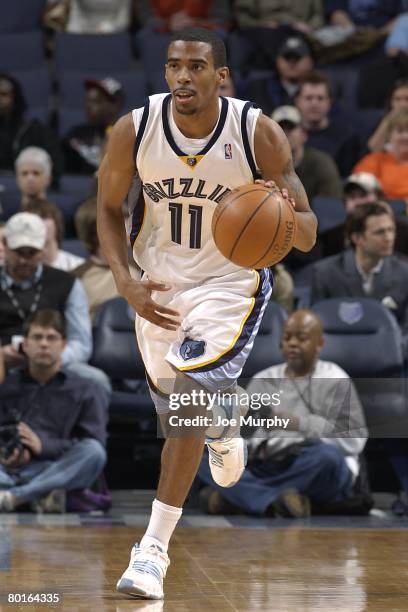 Mike Conley of the Memphis Grizzlies moves the ball during the NBA game against the Phoenix Suns on February 26, 2008 at FedExForum in Memphis,...