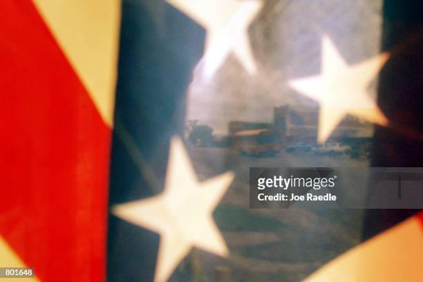 An American flag is on display on the main street of US President George W. Bush's hometown April 13, 2001 in Crawford, Texas. Bush's 1,600-acre...