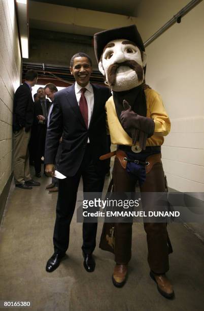 Democratic presidential candidate Illinois Senator Barack Obama poses with University of Wyoming mascot Pistol Pete prior to entering a campaign...