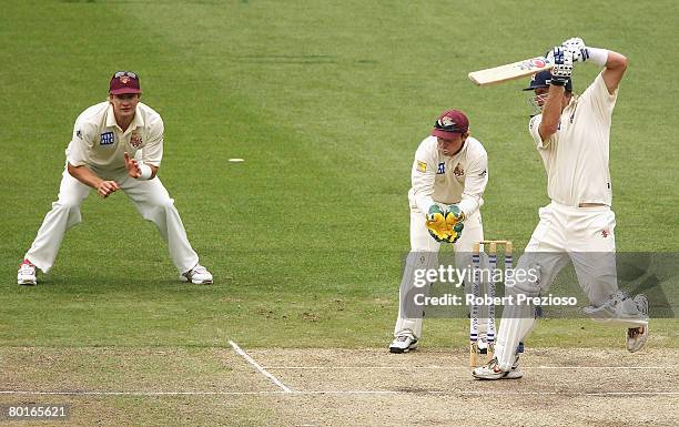 Cameron White of the Bushrangers plays a shot during day two of the Pura Cup match between the Victorian Bushrangers and the Queensland Bulls at the...