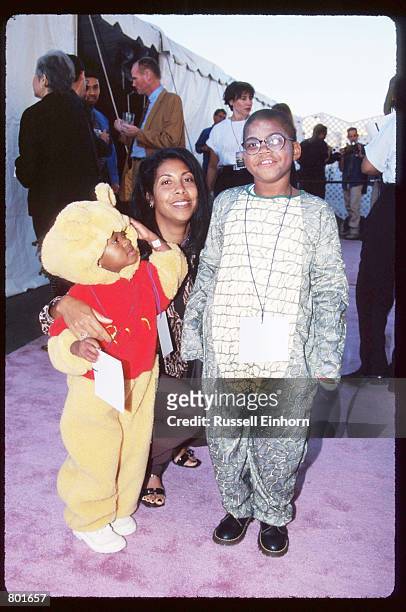 Earvin "Magic" Johnson's wife Cookie poses with daughter Elisa and son E.J. October 25, 1997 in Los Angeles, CA. Johnson won five championships and...