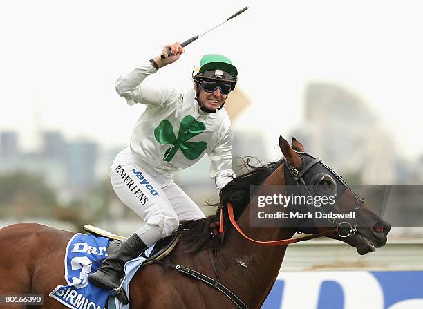 Jockey Peter Mertens riding Sirmione celebrates as he wins Race 8 the Darley Australian Cup during the Australian Cup meeting at Flemington Race...