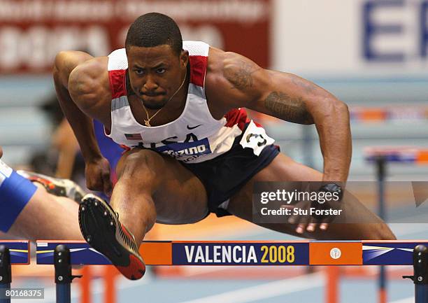 David Oliver of USA competes in the Mens 60 Metres Hurdles Heats during the 12th IAAF World Indoor Championships at the Palau Lluis Puig on March 8,...