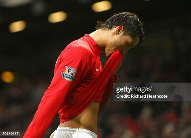 Christano Ronaldo of Manchester United walks off the pitch dejected after defeat in the FA Cup Sponsored by e.on Quarter Final match between...