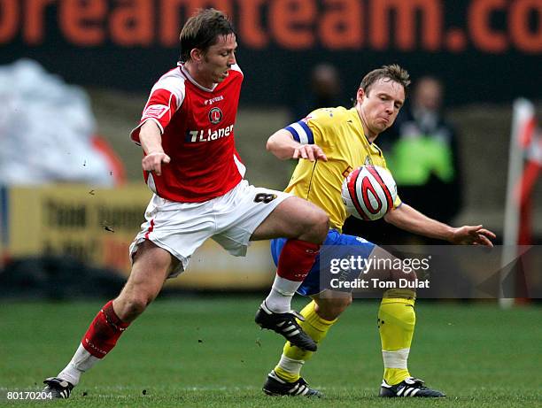 Matt Holland of Charlton Athletic battles for the ball with Paul McKenna of Preston North End during the Coca Cola Championship match between...