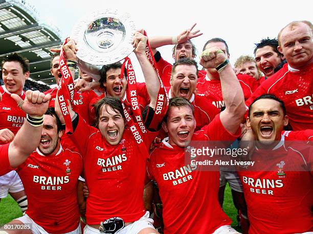 The Wales players celebrate with the Triple Crown following their team's victory at the end of the RBS 6 Nations Championship match between Ireland...