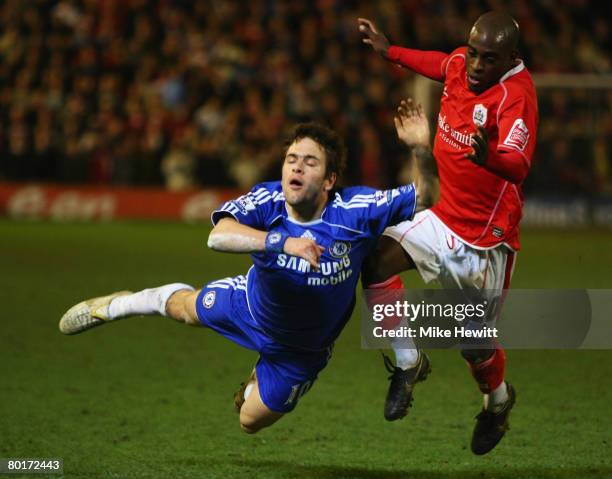 Joe Cole of Chelsea is tripped by Jamal Campbell-Ryce of Barnsley during the FA Cup sponsored by E.ON 6th Round match between Barnsley and Chelsea at...