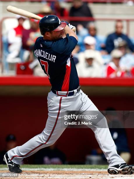 Outfielder Jeff Francoeur of the Atlanta Braves fouls off a pitch against the Cincinnati Reds during the Grapefruit League Spring Training game on...