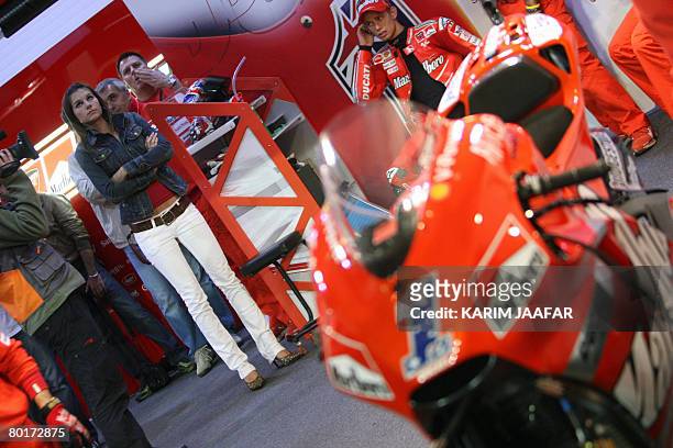 Australian rider Casey Stoner and his wife Adriana attend the 2008 MotoGP qualifying practice in Doha on March 8, 2008. World champion Stoner begins...