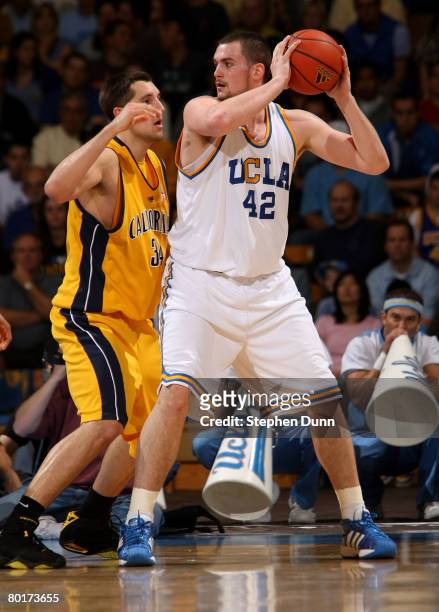 Kevin Love of the UCLA Bruins controls the ball against Ryan Anderson of the California Golden Bears on March 8, 2008 at Pauley Pavillion in...