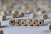 punish - cube with letters, sign with wooden cubes