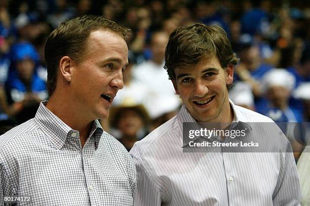 Peyton Manning and brother Eli Manning watch on at the Duke Blue Devils versus North Carolina Tar Heels during their game at Cameron Indoor Stadium...