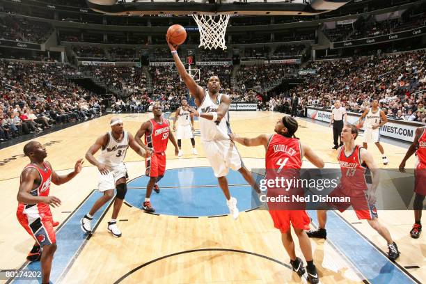 Antawn Jamison of the Washington Wizards shoots against Jared Dudley of the Charlotte Bobcats at the Verizon Center on March 8, 2008 in Washington,...