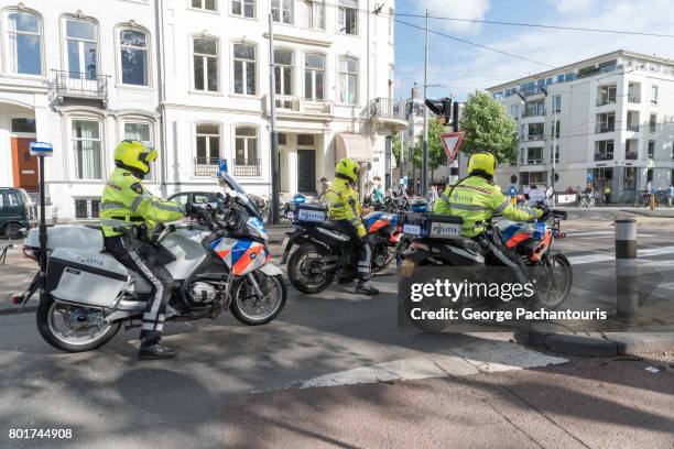 policemen in motorcycles in amsterdam, netherlands - police motorbike stock pictures, royalty-free photos & images