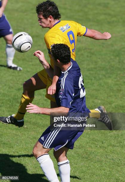 John Lang of Otago heads the ball away from Riki van Steeden of Auckland City during the round 17 New Zealand Football Championship match between...