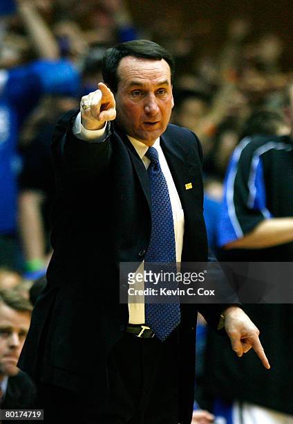 Head coach Mike Krzyzewski of the Duke Blue Devils points to his defense during the second half against the North Carolina Tar Heels at Cameron...