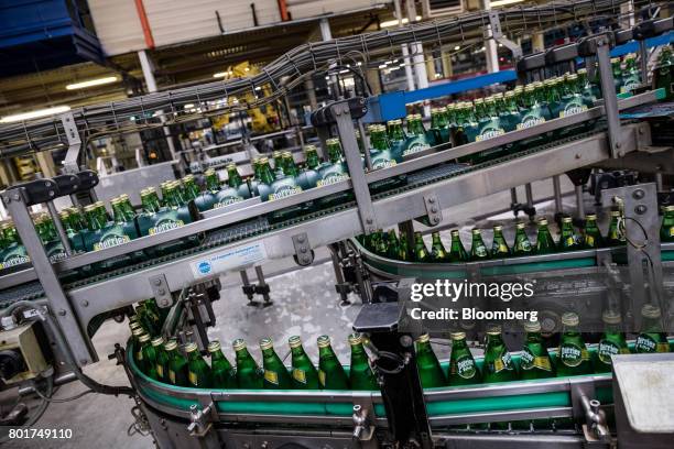 Bottles of Perrier mineral water move along the production line at the Nestle SA bottling plant in Vergeze, France, on Monday, June 19, 2017. The...