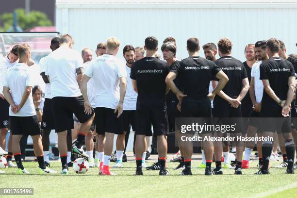 Jochim Loew , head coach of team Germany talks to his players during a team Germany training session at Park Arena training ground on June 27, 2017...