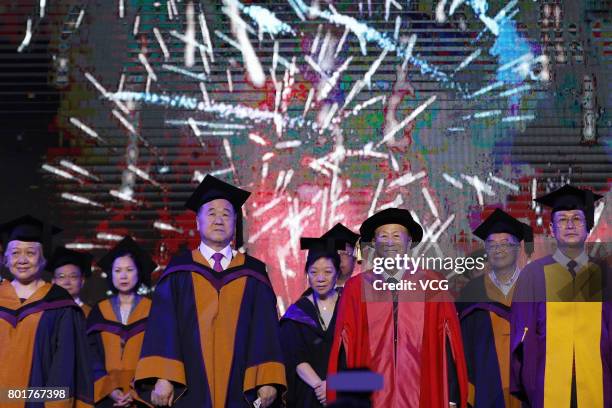 Nobel Prize winner in Literature Mo Yan and Chinese entrepreneur Li Ka-shing attend the graduation ceremony of Shantou University on June 27, 2017 in...