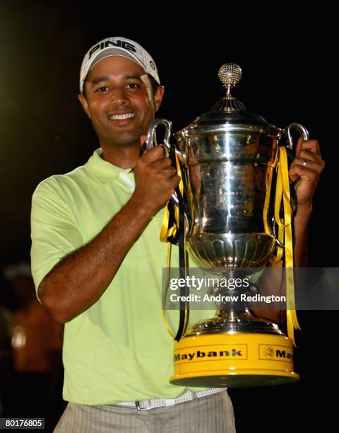 Arjun Atwal of India poses with the trophy after winning the Maybank Malaysian Open held at the Kota Permai Golf & Country Club on March 9, 2008 in...