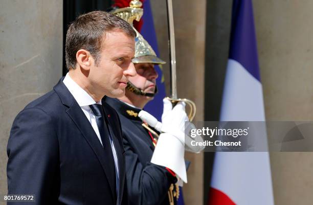 French President Emmanuel Macron looks on prior to a meeting with Ukrainian President Petro Poroshenko at the Elysee Presidential Palace on June 26,...