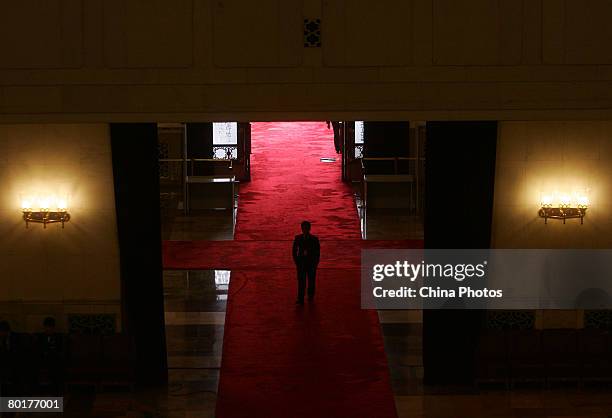 An attendant walks at the Great Hall of the People during the third plenary meeting of the CPPCC on March 9, 2008 in Beijing, China. The CPPCC is the...