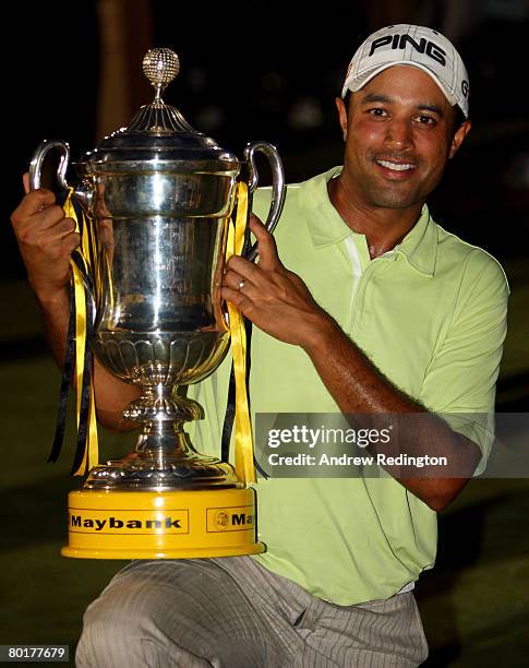 Arjun Atwal of India poses with the trophy after winning the Maybank Malaysian Open held at the Kota Permai Golf & Country Club on March 9, 2008 in...