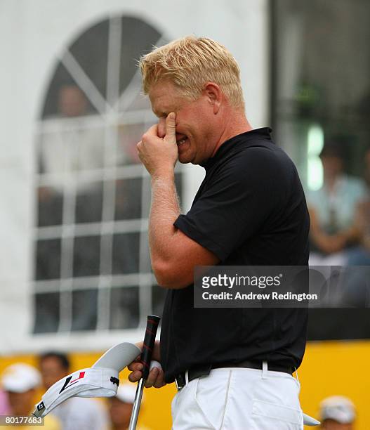 Peter Hedblom of Sweden looks dejected after narrowly missing a putt for victory on the 18th hole during the final round of the Maybank Malaysian...