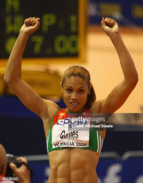 Naide Gomes of Portugal celebrates her Gold Medal win after the Womens Long Jump Final during the 12th IAAF World Indoor Championships at the Palau...