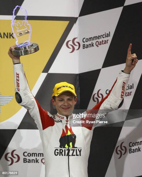 Stefan Bradl of Germany and the Ajo Motorsport Team holds alots his trophy after finishing third in the 125cc Motorcycle Grand Prix of Qatar, round...
