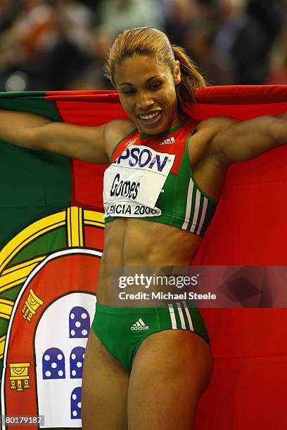 Naide Gomes of Portugal celebrates her Gold Medal win after the Womens Long Jump Final during the 12th IAAF World Indoor Championships at the Palau...