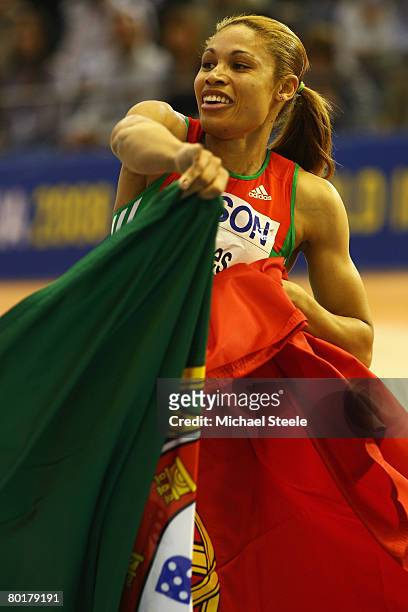 Naide Gomes of Portugal celebrates her Gold Medal win after the Womens Long Jump Final during the 12th IAAF World Indoor Championships at the Palau...