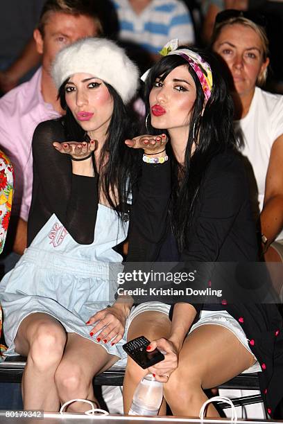 Singers Jessica Origliasso and Lisa Origliasso of the Veronicas sit before the Target Rocks Red Market show as part of the L'Oreal Melbourne Fashion...