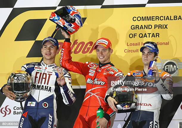 Jorge Lorenzo of Spain and Fiat Yamaha Team , Casey Stoner of Australia and the Ducati Marlboro Team , and Dani Pedrosa of Spain and the Repsol Honda...