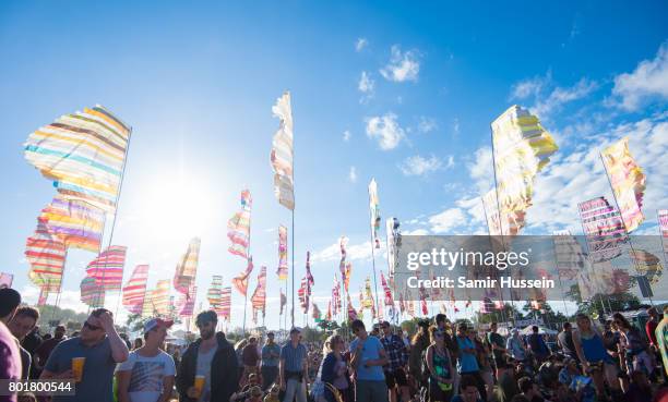 Festival goers enoy the sunshine attends as they attend on day 4 of the Glastonbury Festival 2017 at Worthy Farm, Pilton on June 25, 2017 in...