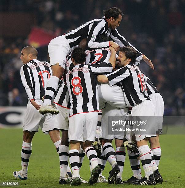 David Trezeguet is congratulated by his Juventus teammates after scoring the second goal during the Serie A match between Genoa and Juventus at the...