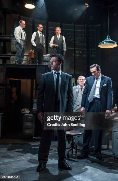 Richard Coyle as Larry Lamb and Bertie Carvel as Rupert Murdoch with the Company perform on stage in a new production of the play "Ink" at The...