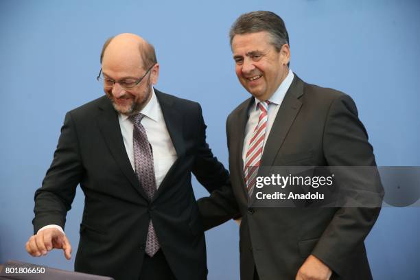 Leader of Germany's Social Democrats Martin Schulz and German Foreign Minister Sigmar Gabriel attend a press conference on four-year rulership...