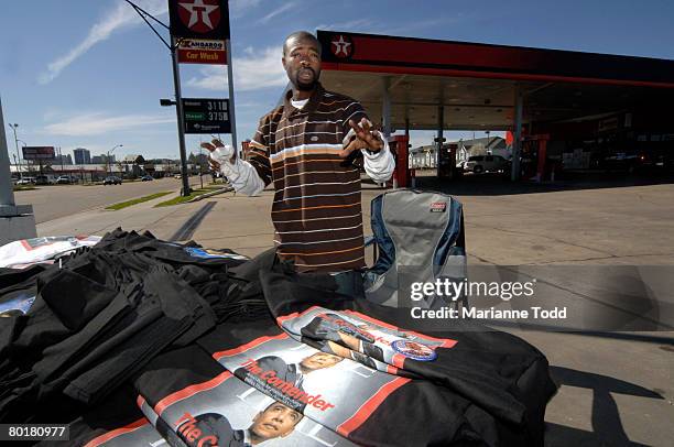 Supporter of Democratic presidential hopeful Sen. Barack Obama Moe Mac of Dallas, Texas, sells T-shirts on High Street while traveling the Obama...