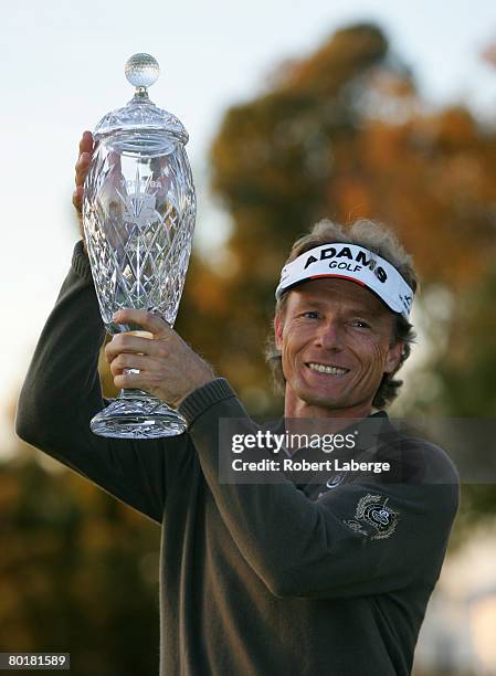 Bernhard Langer of Germany holds the winner's trophy after winning the PGA Champions Tour Toshiba Classic on the seventh sudden death hole at the...
