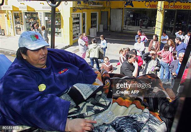 Manuel Uribe , the world's fattest man according to the Guinness Book of Records, smiles while leaving for a drive atop a truck on March 9, 2008...