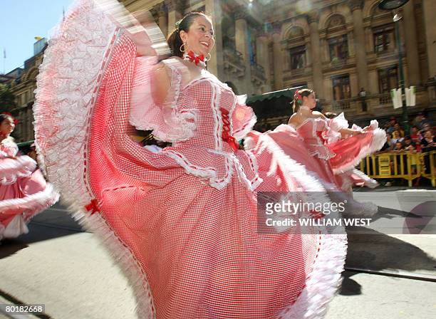 Dancers make their way through the city streets during the Moomba Parade in Melbourne on March 10, 2008. The parade is part of the Moomba festival...