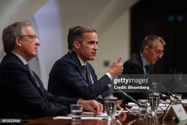 Mark Carney, governor of the Bank of England , center, gestures while speaking as Jon Cunliffe, deputy governor for financial stability at the Bank...